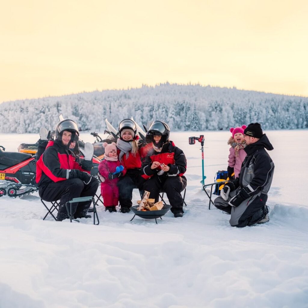 StayLapland Ice Fishing with Snowmobile activity, snowmobiling and ice fishing tour, ice fishing and snowmobiling safari. Rovaniemi, lapland, finland. Kuoksa wilderness park.