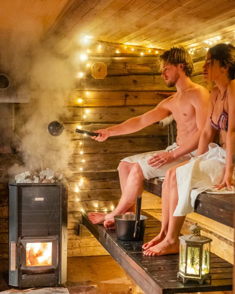 StayLapland Private wooden heated sauna and ice swimming Sauna activity drone photo. Rovaniemi, lapland, finland. Kuoksa wilderness park