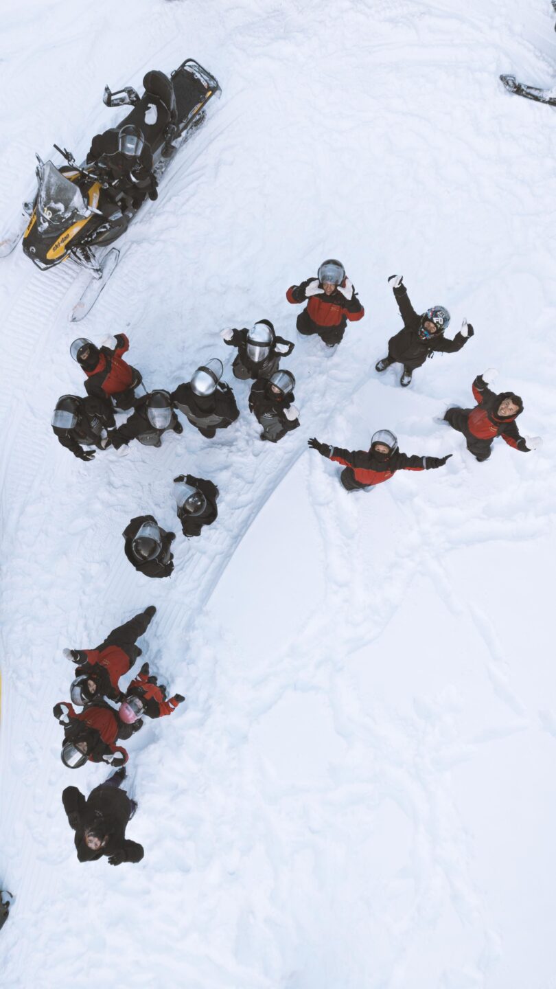 StayLapland Guides waving to drone in Rovaniemi, lapland. Finland